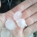 Омичи показали фото последствий крупного града и мощного ливня